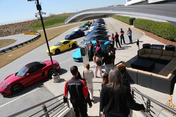 Guests are lead to the cars at the Porsche Experience Center Atlanta on International Women's Day. (Tyson Horne / tyson.horne@ajc.com)