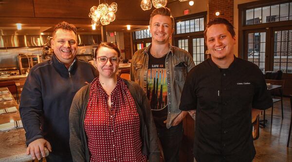 Cory Harwell (owner; from left), Molly Barlow (assistant general manager), David English (general manager) and Casey Carstens (executive sous chef) at Carson Kitchen in Alpharetta. CONTRIBUTED BY CHRIS HUNT PHOTOGRAPHY