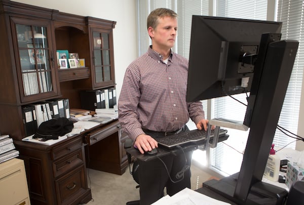 Aaron Dixon works at his desk at the Alston & Bird offices in Atlanta on January 24th, 2018. For story in the AJC Top Workplaces section.  (Photo by Phil Skinner)