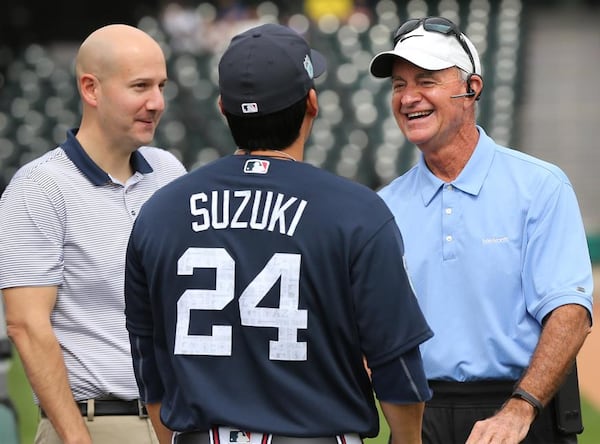  Then-Braves GM John Coppolella (left) and president of baseball operations John Hart chatted with veteran catcher Kurt Suzuki at spring training. Hart is now serving as GM until a permanent replacement is hired after Coppolella was forced to resign amid an MLB investigation. (Curtis Compton/AJC photo)