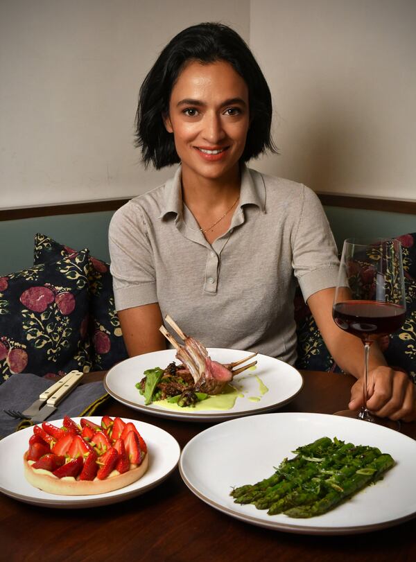 “In my mind, spring is about a fresh start and rebirth,” says Le Bon Nosh chef Forough Vakili. She's shown with spring recipes she's sharing with AJC readers: (clockwise from left) Strawberry Tart, Georgia-Grown Grilled Lamb Rack with Pea and Morel Ragu, and Grilled Green Asparagus with Ramps Sauce. (Styling by chef Forough Vakili / Chris Hunt for the AJC)