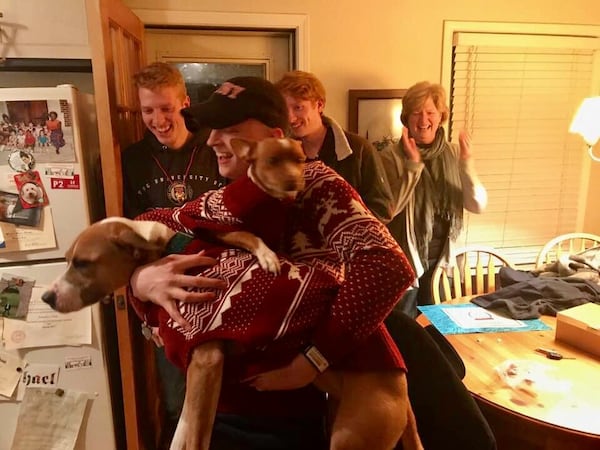 After eight months of chemo and two surgeries, Michael was released from care and hopefully cured as he came home for Christmas 2017. He was happy to see his dapper dogs. (Photo by Phil Huelson)