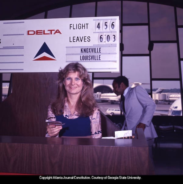 A Delta Air Lines ticket agent works in Atlanta's then-Hartsfield Airport in 1977. (AJC file)