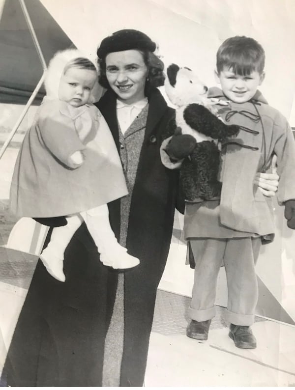 A newspaper photo from 1955 when Helen Gilligan brought two Irish children to Chicago for adoption.