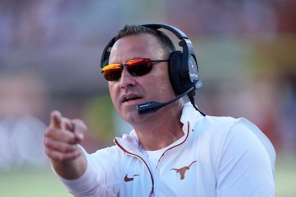 Texas head coach Steve Sarkisian signals during the first half of an NCAA college football game against Kentucky in Austin, Texas, Saturday, Nov. 23, 2024. (AP Photo/Eric Gay)