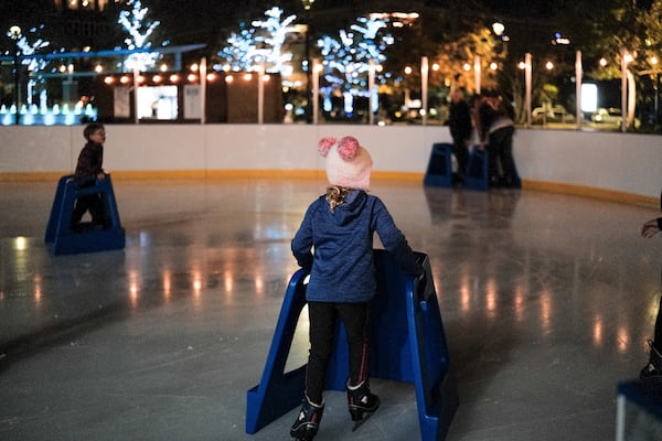 Young skaters train on a rink bathed in holiday lights at Skate City Springs at City Green. Courtesy of the city of Sandy Springs