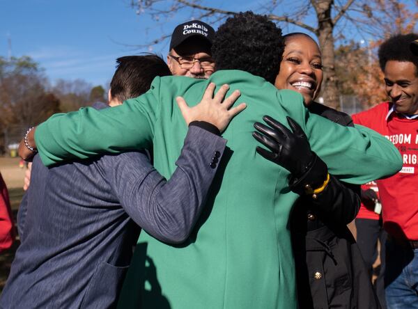 211120-Atlanta-Atlanta Mayoral candidate Felicia Moore hugs DeKalb County Commissioner Ted Terry, left, and DeKalb County Sheriff Melody Maddox after they endorsed her during a press conference in Kirkwood on Saturday morning, Nov. 20, 2021. Ben Gray for the Atlanta Journal-Constitution