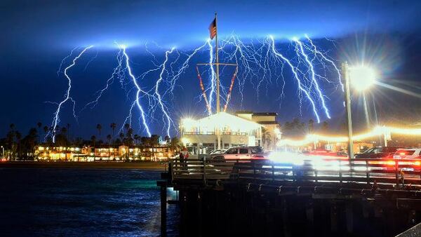 This time exposure photo provided by the Santa Barbara County Fire Department shows a series of lightning strikes over Santa Barbara, Calif., seen from Stearns Wharf in the city's harbor, Tuesday evening, March 5, 2019.