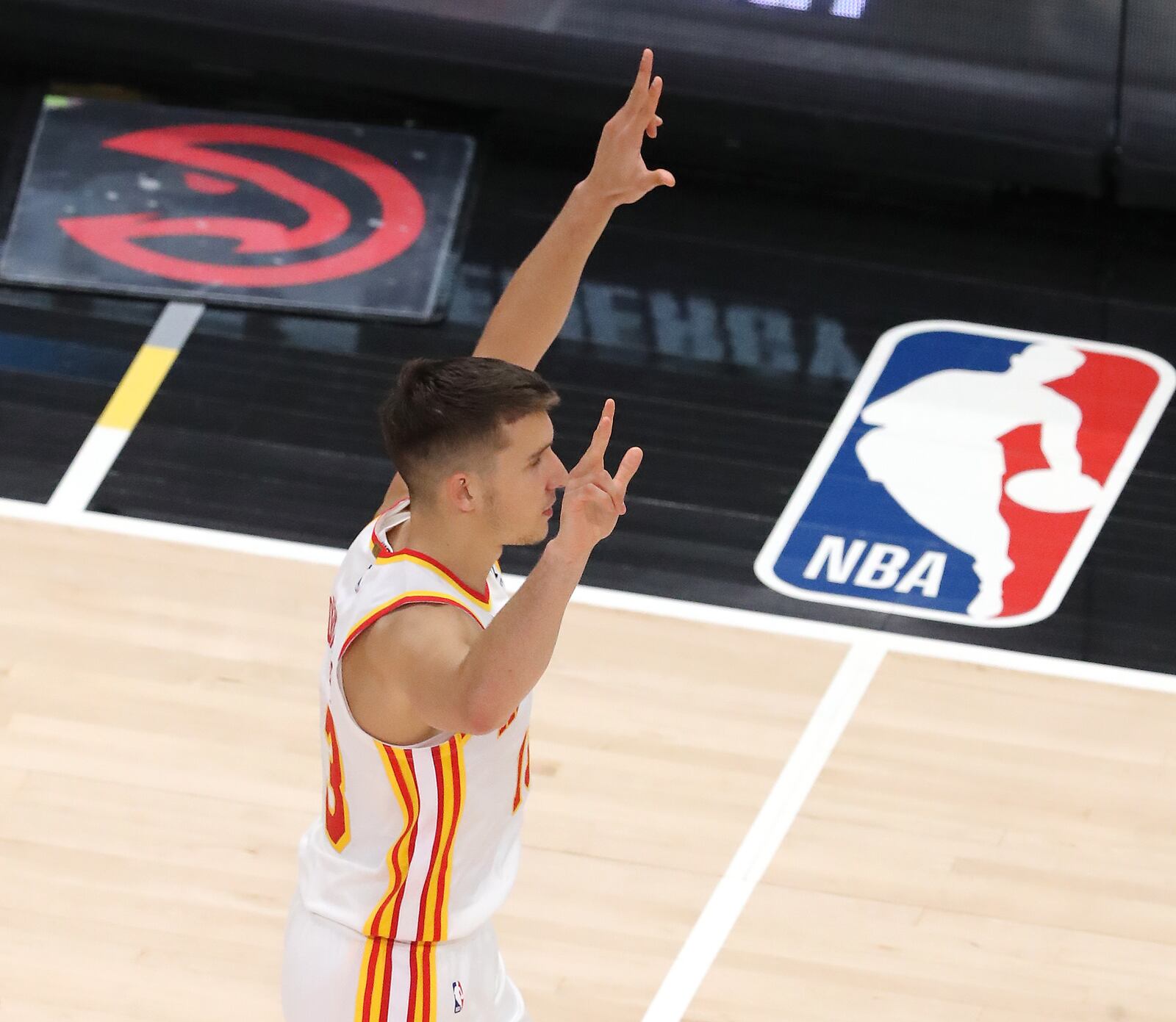 Hawks guard Bogdan Bogdanovic reacts to hitting a three pointer against the Indiana Pacers Sunday, April 18, 2021, at State Farm Arena in Atlanta. (Curtis Compton / Curtis.Compton@ajc.com)