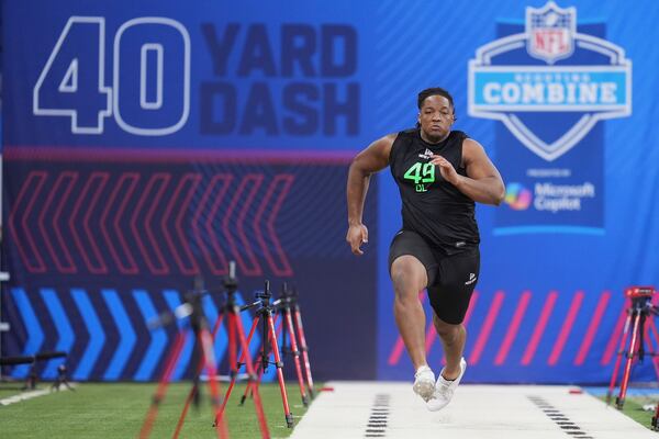 Georgia offensive lineman Jared Wilson runs the 40-yard dash at the NFL football scouting combine in Indianapolis, Sunday, March 2, 2025. (AP Photo/Michael Conroy)