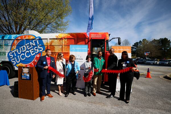 Vasanne S. Tinsley, Interim Superintendent of Dekalb County Public Schools (third on the left), cuts the ribbon during the new Students Success Mobile Center unveiling at Lithonia High School on Wednesday, March 29, 2023.
 Miguel Martinez / miguel.martinezjimenez@ajc.com