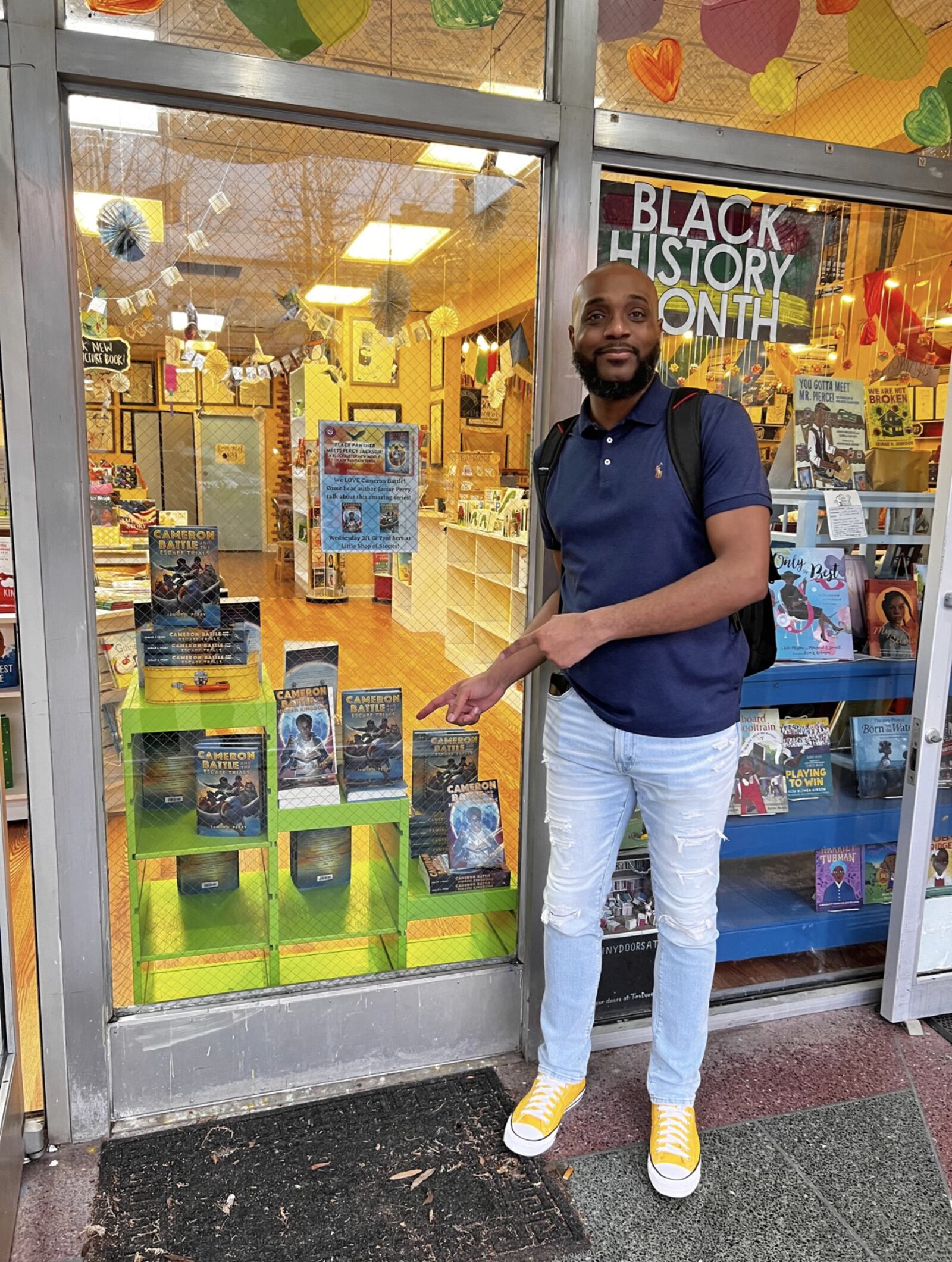 Perry outside of the Decatur bookstore, Little Shop of Stories. Perry was uncertain about the Wednesday evening event because his audience, who are mainly kids, have to rely on their parents for transportation.