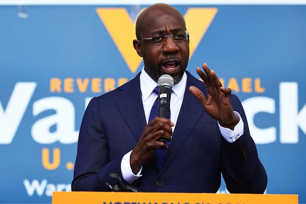 Sen. Raphael Warnock, shown campaigning in January 2021, tested positive for COVID-19 this week, along with Sen. Susan Collins and others. (Michael M. Santiago/Getty Images/TNS)