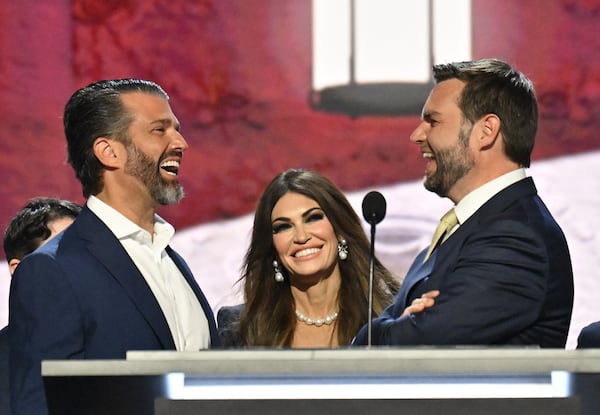 U.S. Sen. JD Vance (right) R-Ohio, shares a laugh with Donald Trump Jr. (left) and Kimberly Guilfoyle at the Republican National Convention in Milwaukee.