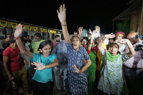 Villagers dance as they celebrate the safe return of NASA astronaut Suni Williams from the International Space Station (ISS), at a temple in her ancestral village Jhulasan in Mehsana district of Gujarat state, India, Wednesday, March 19, 2025. (AP Photo/Ajit Solanki)