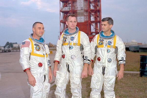 From left, Apollo 1 astronauts Gus Grissom, Ed White and Roger Chaffee pose in front of their Saturn 1 launch vehicle at Launch Complex 34 at Cape Canaveral. On January 27, 1967, the crew was sitting above the launch pad for a pre-launch test when a fire broke out in their capsule. The investigation into the fatal accident led to major design changes, making the Apollo spacecraft safer for the coming journeys to the Moon.  