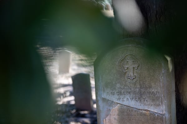 Pvt. Lucien Weakley’s headstone stands beneath a towering magnolia tree that is surrounded by the graves of thousands of other Confederate soldiers in Atlanta’s Oakland Cemetery. The marker says the Tennessee native died in Atlanta in 1863, a month after he was mortally wounded in the bloody Battle of Chickamauga. Arvin Temkar/AJC