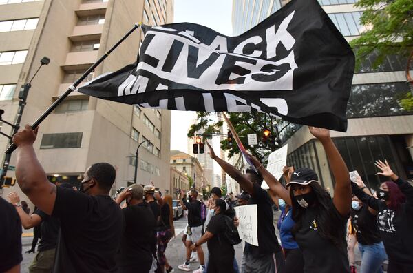 April 20, 2021 Atlanta - People march following the verdict in the murder trial of Derek Chauvin, a former Minneapolis police office, on Tuesday, April 20, 2021. Like the rest of the country, Atlanta residents awaited the verdict Tuesday afternoon for former Minneapolis police Officer Derek Chauvin, who is accused of killing George Floyd. At 5 p.m., the verdict was announced: Guilty. (Hyosub Shin / Hyosub.Shin@ajc.com)