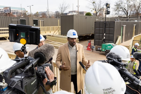 Atlanta Mayor Andre Dickens holds a news conference following a tour of 184 Forsyth St., a development of shipping containers repurposed into housing for unhoused people, last year in Atlanta. (Arvin Temkar/AJC 2023)