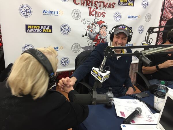  Mark Arum jokes with Karen Emory on air. CREDIT: Rodney Ho/ rho@ajc.com