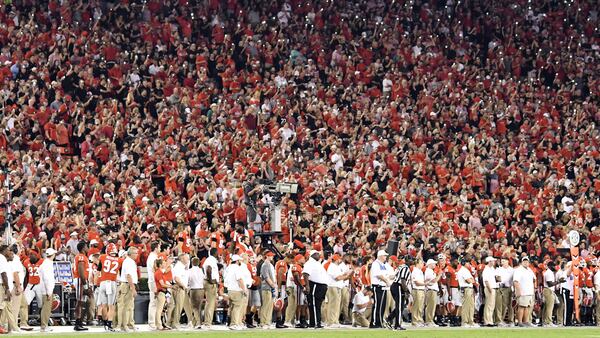 Georgia football fans light up Sanford Stadium at the start of the fourth quarter Sept. 23, 2017, in Athens.