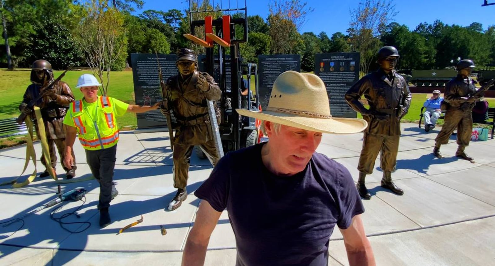 Sculptor Jay Warren, front, created four larger-than-life sculptures, including one of Col. Ralph Puckett Jr., for installation at the Korean War Memorial at the National Infantry Museum. (Photo Courtesy of Mike Haskey)