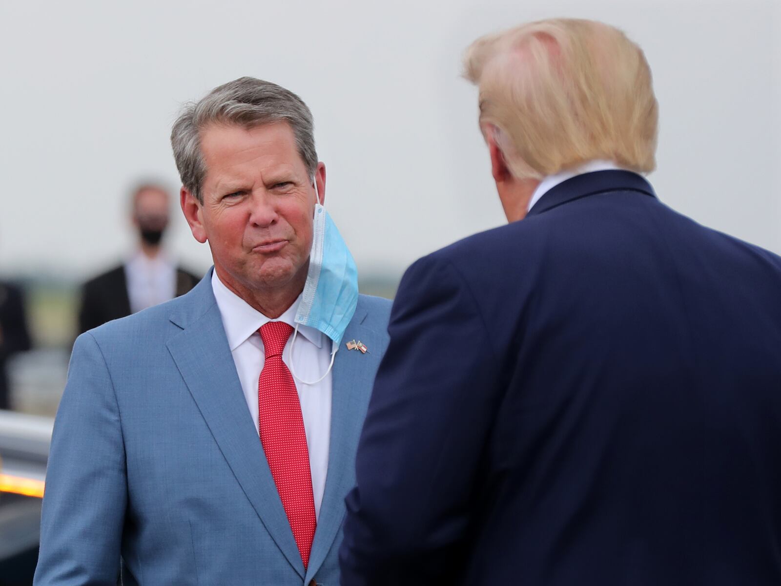 071520 Atlanta: Georgia Governor Brian Kemp greets President Donald Trump as he visits Georgia to talk about an infrastructure overhaul at the UPS Hapeville hub at Hartsfield-Jackson International Airport on Wednesday July 15, 2020 in Atlanta. The visit focuses on a rule change designed to make it easier to process environmental reviews.  Curtis Compton ccompton@ajc.com