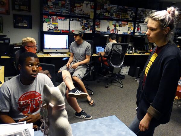 Ziggy (left) earlier this week made calls to alums. He consults with Ana (right) CREDIT: Rodney Ho/rho@ajc.com