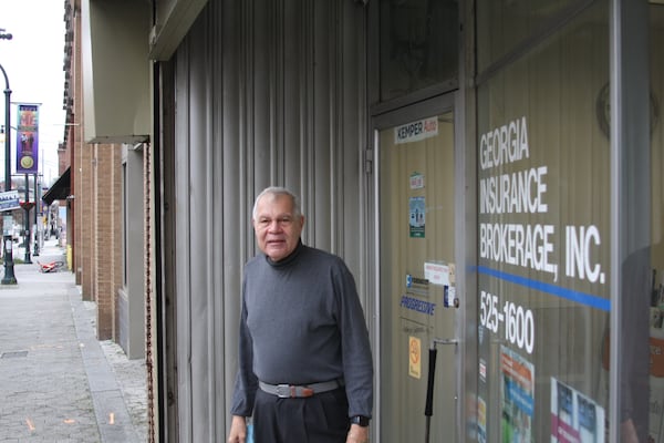 Wellington Howard opened his Georgia Insurance Brokerage 52 years ago, purchasing his 1920s era building in 1970 for $12,000, long after the highway split the neighborhood.