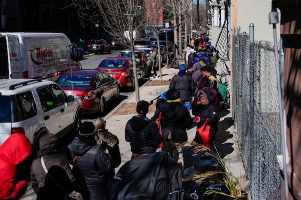 People wait in line to receive free eggs from FarmerJawn Agriculture, Friday, March 21, 2025, in the Harlem neighborhood of New York. (AP Photo/Julia Demaree Nikhinson)