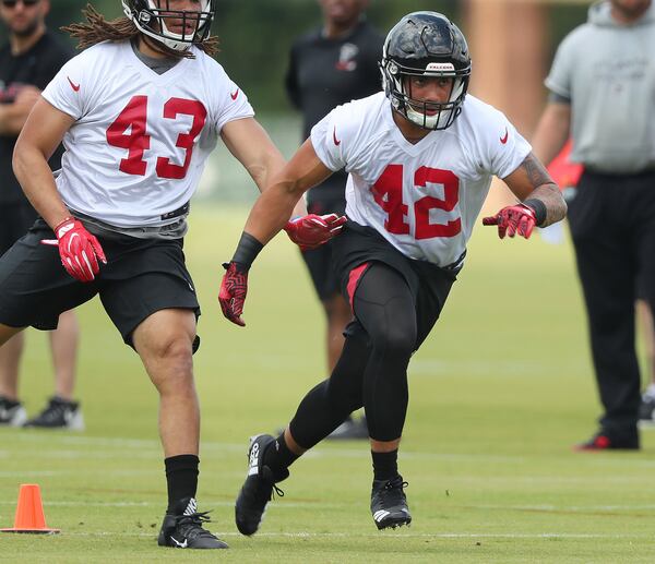 Falcons rookie linebacker Duke Riley runs a drill during rookie minicamp Friday. Curtis Compton/ccompton@ajc.com