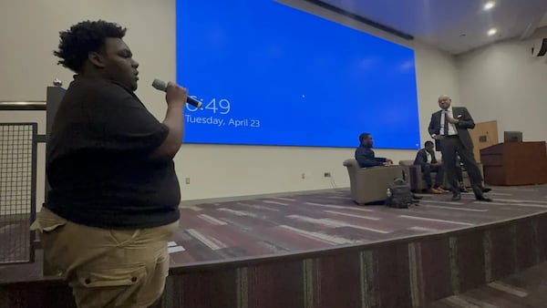 An unnamed student (left) concerned about civilians in Gaza speaks to Morehouse College President David A. Thomas during a recent town hall forum. (Photo Courtesy of Chauncey Alcorn/Capital B)