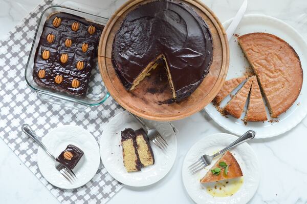 Trio of blender baking recipes: from left, Gluten-Free Chocolate Snack Cake and Blender Yellow Layer Cake, both topped with Old-Fashioned Chocolate Frosting, and Vegan Lemon Olive Oil Cornmeal Cake. 
(Virginia Willis for The Atlanta Journal-Constitution)