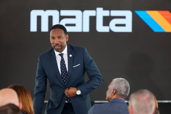 Atlanta mayor Andre Dickens grabs a seat before the groundbreaking ceremony for MARTA’s Summerhill Bus Rapid Transit Line at the corner of Hank Aaron Drive and Georgia Avenue, Thursday, June 15, 2023, in Atlanta.  (Jason Getz / Jason.Getz@ajc.com)