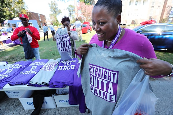 Ms. Chellita Carlyle buys a Straight Outta Paine shirt during a college spirit event on the campus at Paine College on Wednesday, Nov. 1, 2017, in Augusta. (Curtis Compton / ccompton@ajc.com)