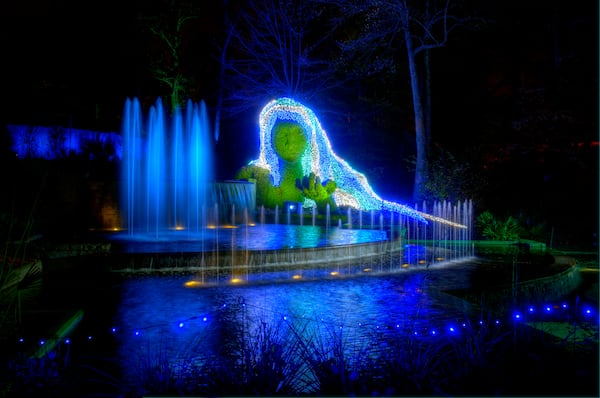 The 25-foot ice goddess at Atlanta Botanical Garden during "Garden Lights, Holiday Nights" utilizes 15,000 lights to illuminate the goddess' flowing hair.