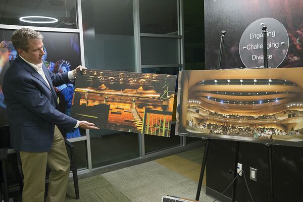 Alliance Theatre managing director Mike Schleifer shows off a before and after digital rendition of the renovation. ALYSSA POINTER/ALYSSA.POINTER@AJC.COM