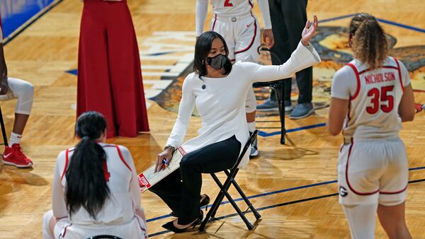 Georgia coach Joni Taylor holds her meeting respecting social distancing during the first half of their first-round game of the women's NCAA Tournament Monday, March 22, 2021, at the Greehey Arena in San Antonio, Texas. (Ronald Cortes/AP)