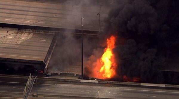 The bridge collapsed from the heat of the fire, leaving a huge hole in the interstate. (Credit: Channel 2 Action News)