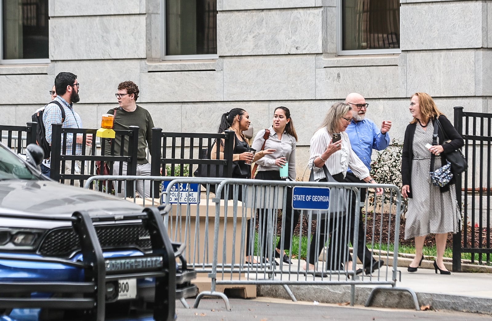 Staff evacuate the Georgia State Capitol after a gas leak at Piedmont Avenue and Martin Luther King Jr. Drive impacts surrounding areas.