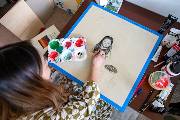 Nicole Kang working on a new painting. (Photo Courtesy of Isadora Pennington)