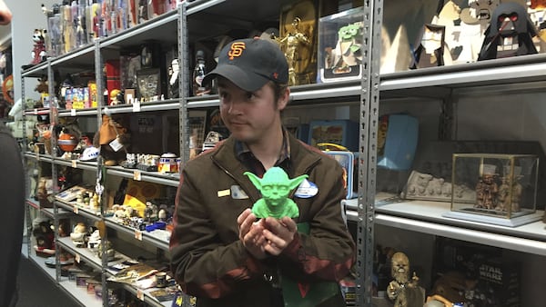 Rancho Obi-Wan docent Lucas Seastrom holds up a statue of Yoda made from a 3-D printer.