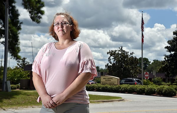 Jammie Duvall stands outside West Central Georgia Hospital where she says she was sexually harassed by a male warehouse worker last year. An internal investigation led to his firing, as well as reprimands of two supervisors and another co-worker.