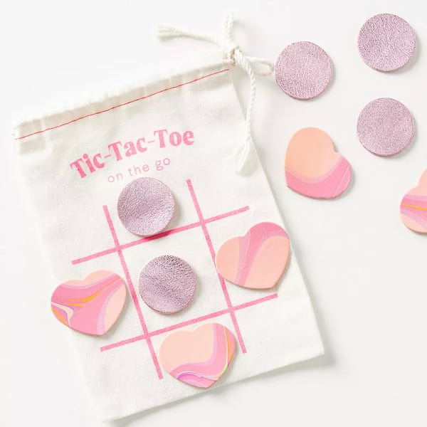 Play games anywhere with a travel size tic-tac-toe inclusive of leather game pieces.