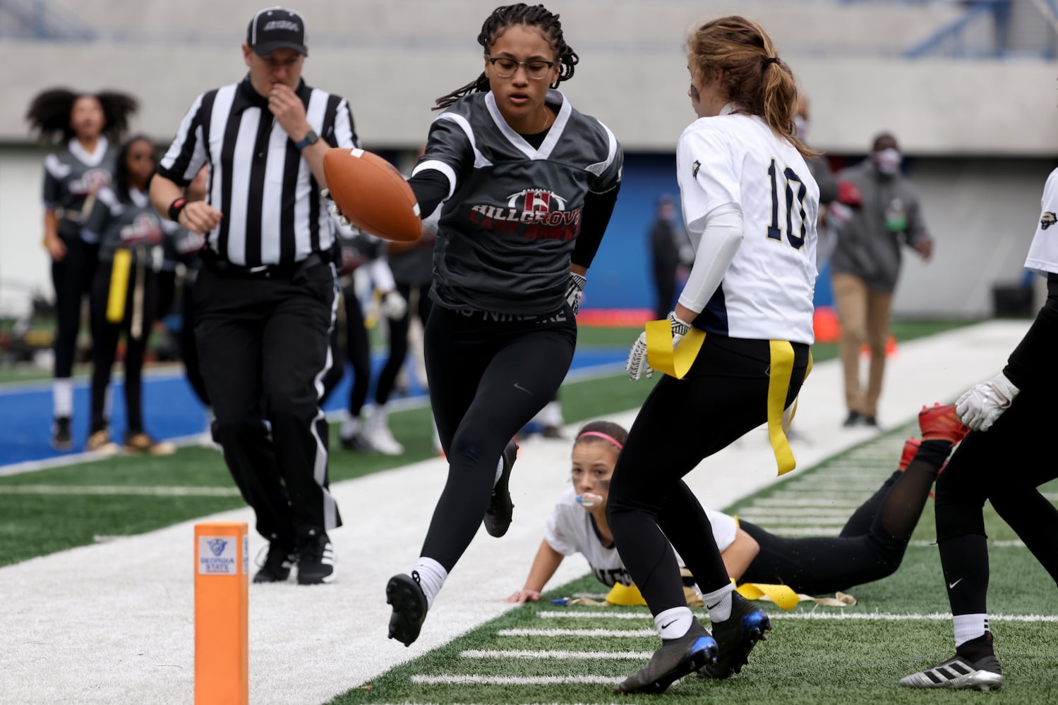 Hillgrove running back Jasmine Blackmon is stopped for a short gain in the first half against West Forsyth during the Class 6A-7A Flag Football championship at Center Parc Stadium Monday, December 28, 2020 in Atlanta, Ga.. JASON GETZ FOR THE ATLANTA JOURNAL-CONSTITUTION