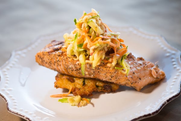 Bogartz Food Artz Hot Smoked Salmon with sweet and savory dry rub, goat cheese potato latke and sweet and sour slaw. Photo credit- Mia Yakel.