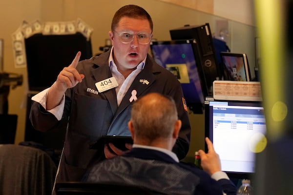 Traders work on the floor of the New York Stock Exchange, Tuesday, March 11, 2025. (AP Photo/Richard Drew)