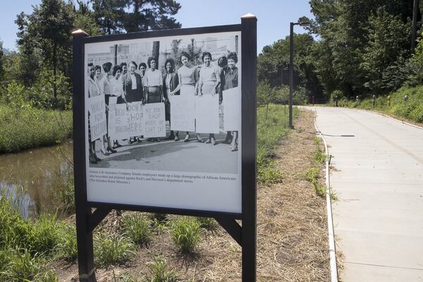 Images from Karcheik Sims-Alvarado’s book, “Images of America: Atlanta and the Civil Rights Movement, 1944-1968,” are displayed along the Atlanta Beltline near Gordon White Park. Sixty images will be paired with descriptions to inform pedestrians as they walk along the Atlanta Beltline. ALYSSA POINTER / ALYSSA.POINTER@AJC.COM