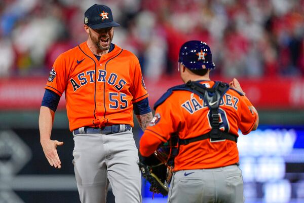 Houston Astros relief pitcher Ryan Pressly and catcher Christian Vazquez celebrate. (AP Photo/Matt Slocum)