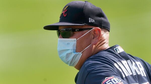 Atlanta Braves manager Brian Snitker looks over the field before final spring training game at CoolToday Park against the Boston Red Sox Monday, March 29, 2021, in North Port, Fla. (John Bazemore/AP)